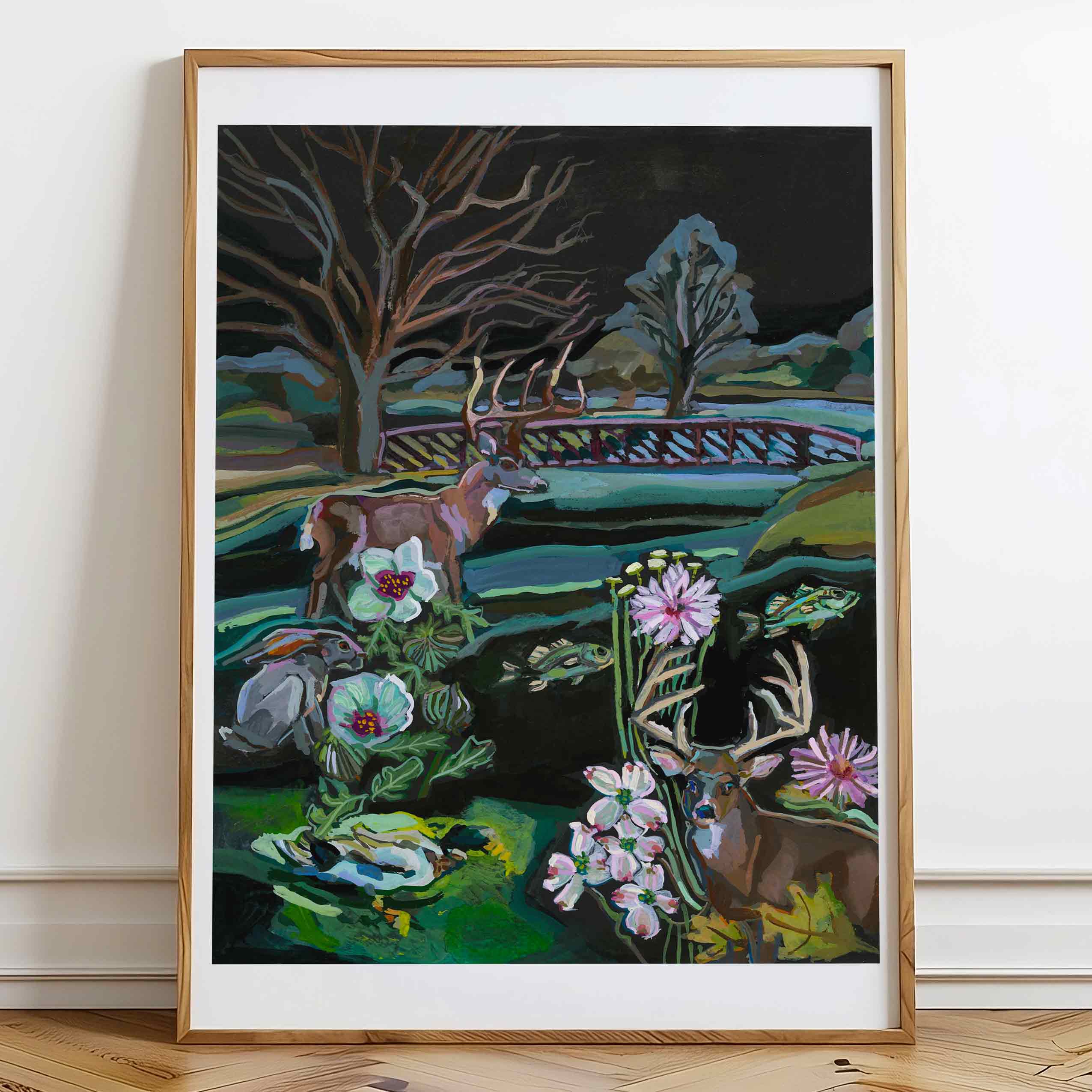 Framed artwork of deer and flowers on a wall