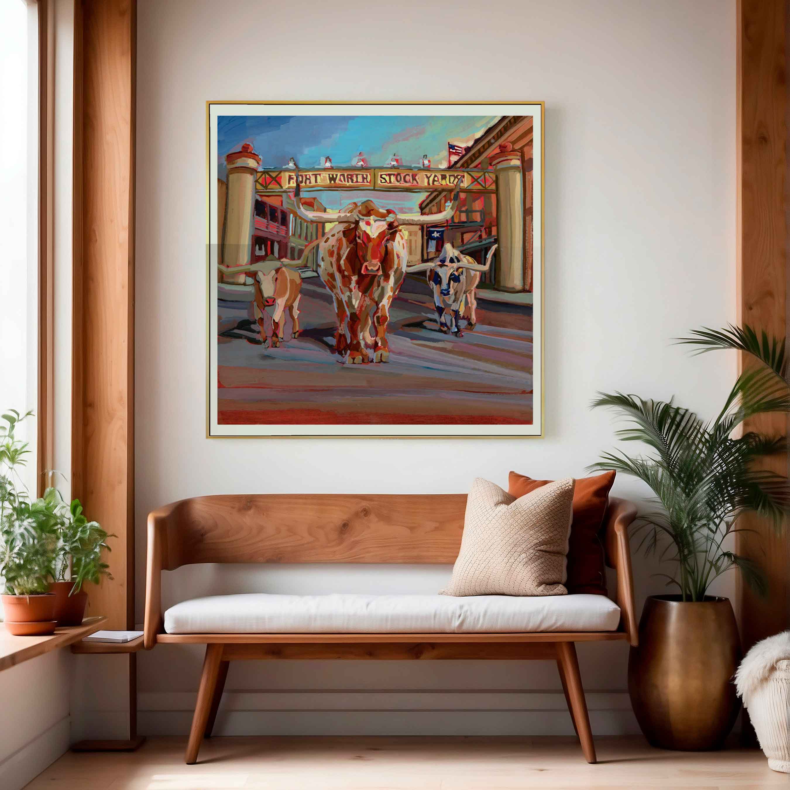 Painting of Texas Longhorns in Fort Worth town scene with Texas flag above a wooden bench with decorative pillows.