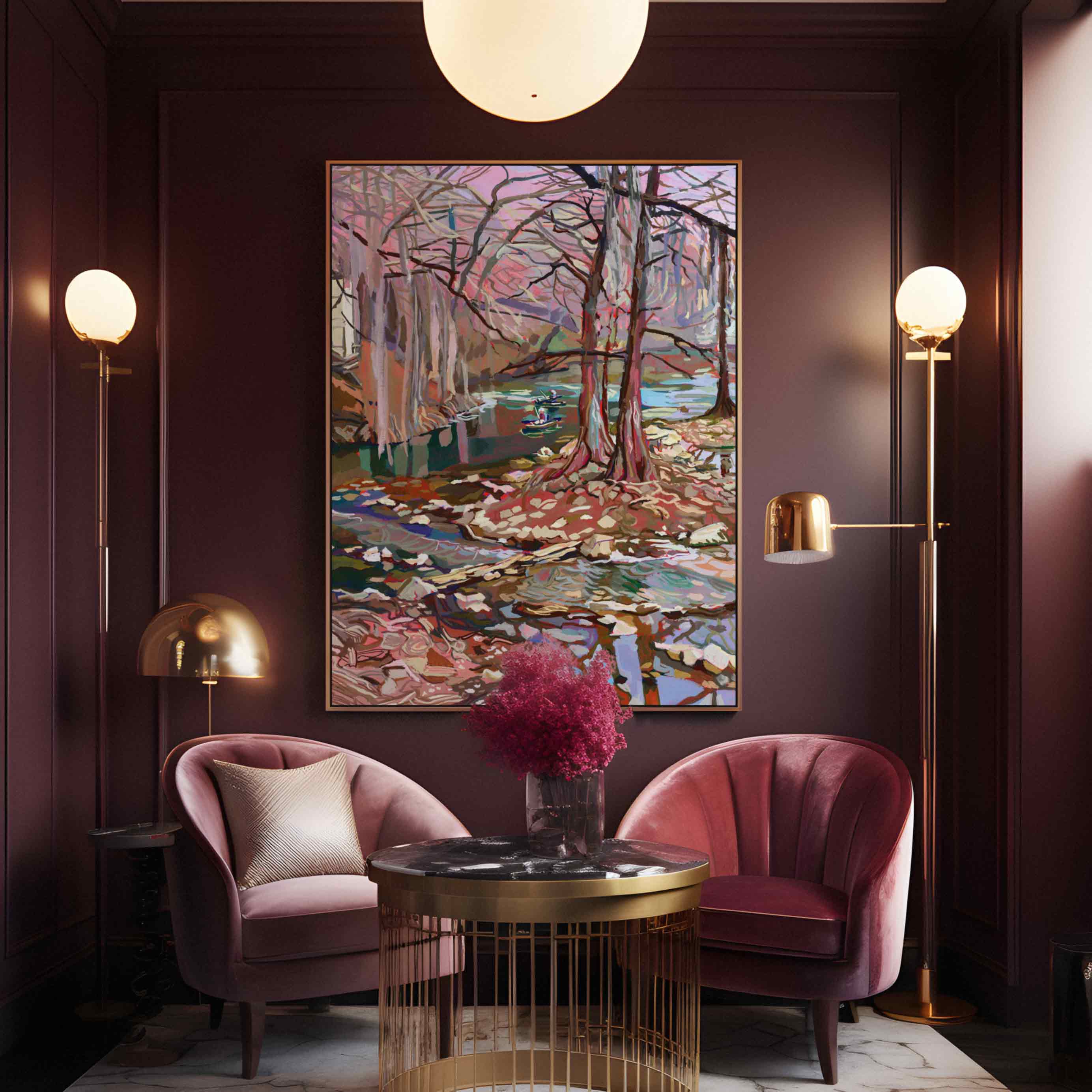 Guadalupe River painting of a landscape with Cypress trees and water on a wall in a large frame. Luxurious Art Deco interior with pink chairs, gold table, and large artwork on a dark wall.